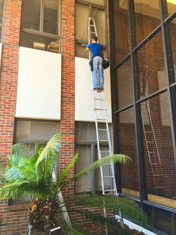 Window washing 3rd floor using ladder
